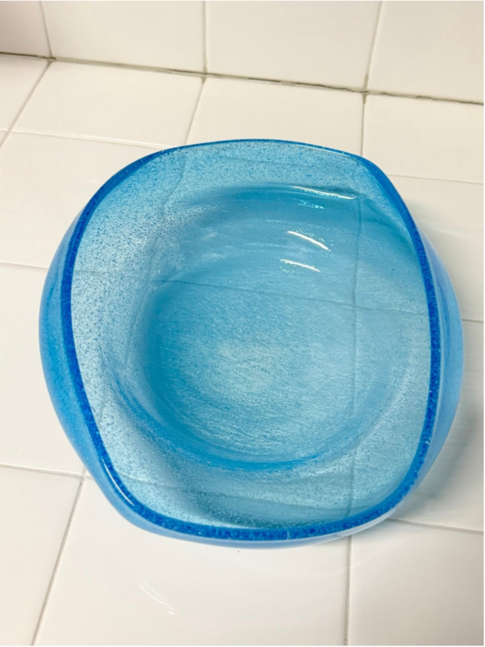 Beautiful light blue curved bowl.